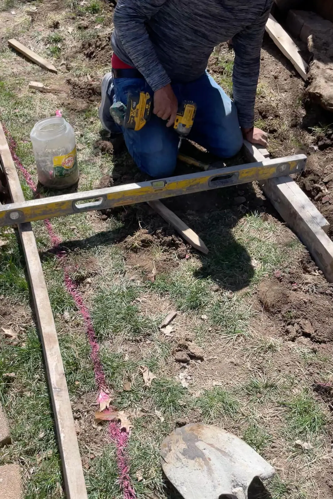 Setting forms for concrete sidewalk.